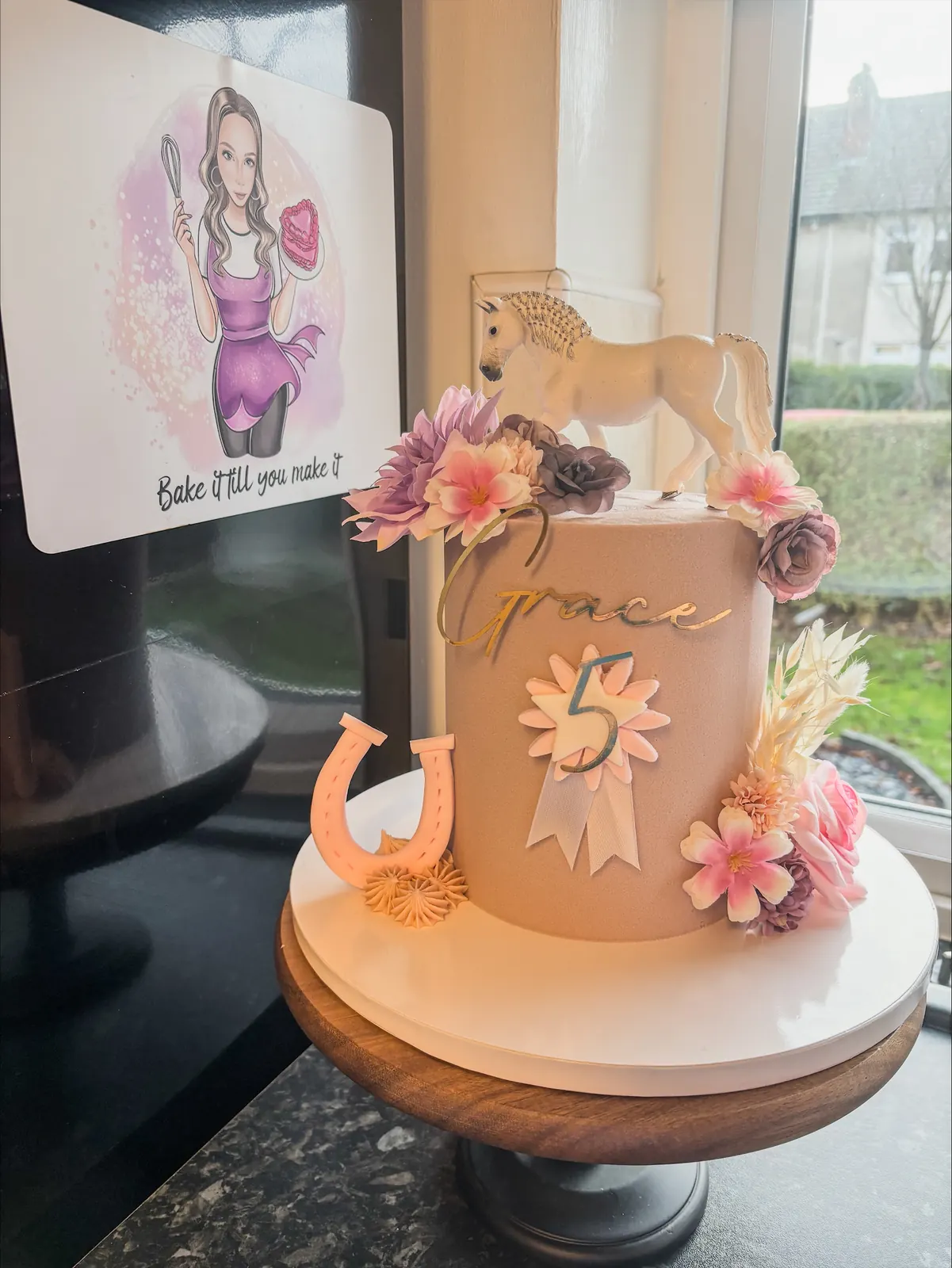 Horse riding floral cake